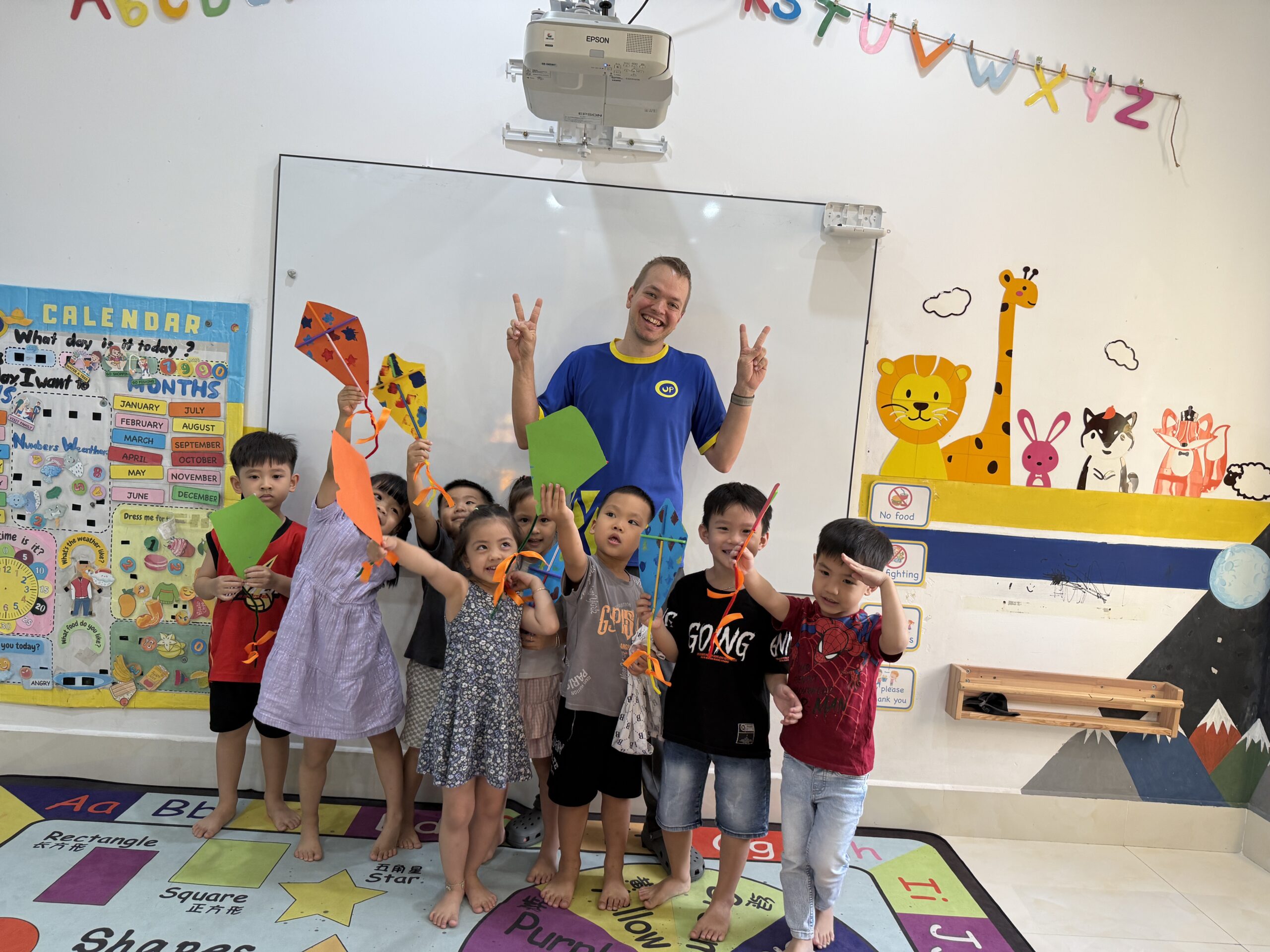 Teacher and students celebrating their classroom projects